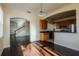 Open-concept living and kitchen area with hardwood floors at 13910 Dove Wing Ct, Orlando, FL 32828