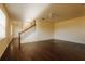 Bright, open living room with hardwood floors and staircase at 13910 Dove Wing Ct, Orlando, FL 32828