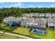 Aerial shot highlighting the backyard of neighborhood homes near a forest with optional pool at 11218 Pixie Mandarin Ct, Winter Garden, FL 34787