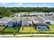 Aerial view showcasing the backyards of neighborhood homes, some with screened-in pools, and wooded areas at 11218 Pixie Mandarin Ct, Winter Garden, FL 34787