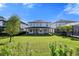 Beautiful backyard with lush green lawn, covered patio, and privacy fencing, ideal for Gathering gatherings and outdoor enjoyment at 11218 Pixie Mandarin Ct, Winter Garden, FL 34787