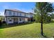 Expansive backyard featuring a covered patio, ideal for entertaining guests or enjoying peaceful evenings at 11218 Pixie Mandarin Ct, Winter Garden, FL 34787