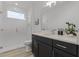 Modern bathroom featuring sleek vanity, subway tile shower, and contemporary fixtures at 11218 Pixie Mandarin Ct, Winter Garden, FL 34787