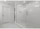 Elegant bathroom boasts a frameless glass shower, subway tile walls, and mosaic tile floor at 11218 Pixie Mandarin Ct, Winter Garden, FL 34787
