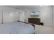 Cozy bedroom featuring a queen-size bed, dresser, and large closet offering ample storage at 11218 Pixie Mandarin Ct, Winter Garden, FL 34787