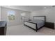Serene bedroom with soft carpet, two windows, and neutral tones creating a relaxing atmosphere at 11218 Pixie Mandarin Ct, Winter Garden, FL 34787