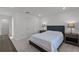 Well-lit bedroom with plush carpet and matching nightstands at 11218 Pixie Mandarin Ct, Winter Garden, FL 34787
