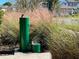 Dog park features a green drinking fountain with a bowl for canine use at 11218 Pixie Mandarin Ct, Winter Garden, FL 34787