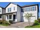 Charming two-story home featuring a two-car garage and manicured landscaping at 11218 Pixie Mandarin Ct, Winter Garden, FL 34787