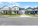 Charming two-story home with white siding, black shutters, attached two car garage, and manicured front lawn at 11218 Pixie Mandarin Ct, Winter Garden, FL 34787