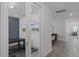 Hallway view leading to an office, featuring stylish flooring and modern lighting at 11218 Pixie Mandarin Ct, Winter Garden, FL 34787