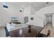 Open-concept living room with high ceilings, contemporary decor and staircase at 11218 Pixie Mandarin Ct, Winter Garden, FL 34787