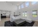 Bright living room with soaring ceilings, oversized sofa, and open kitchen at 11218 Pixie Mandarin Ct, Winter Garden, FL 34787