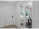 Bright office with a large window, glass door entry, and black desk, perfect for working from home at 11218 Pixie Mandarin Ct, Winter Garden, FL 34787