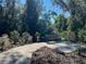 A view of a park bench surrounded by a natural setting and walking path at 11218 Pixie Mandarin Ct, Winter Garden, FL 34787