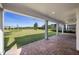 Expansive covered patio with brick flooring offers serene backyard views and ample space for gatherings at 11218 Pixie Mandarin Ct, Winter Garden, FL 34787
