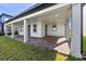 Covered patio with brick pavers and elegant columns, ideal for outdoor entertaining and relaxation at 11218 Pixie Mandarin Ct, Winter Garden, FL 34787