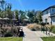 Picturesque walking path through landscaped grounds near pool, bench and bike rack at 11218 Pixie Mandarin Ct, Winter Garden, FL 34787