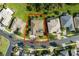 Aerial view of a property with outlined boundaries, showcasing the landscape and surrounding neighborhood at 1221 Glendora N Rd, Kissimmee, FL 34759