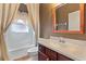 Bathroom with wood vanity and white countertops at 1221 Glendora N Rd, Kissimmee, FL 34759