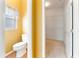 En suite bathroom, toilet, and linen closet at 1221 Glendora N Rd, Kissimmee, FL 34759