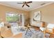 Cozy living room with a sliding glass door leading to an outdoor patio, complete with modern furniture at 1221 Glendora N Rd, Kissimmee, FL 34759