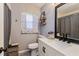 Updated bathroom with modern fixtures, a vanity with white countertop, and elegant decor at 1533 Findlay St, Deltona, FL 32725