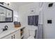 Modern bathroom featuring a sink, toilet, shower and decorative mirror with matching hardware at 1533 Findlay St, Deltona, FL 32725