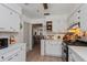 Well-lit kitchen featuring white cabinetry, stainless appliances, and an eat-in nook at 1533 Findlay St, Deltona, FL 32725