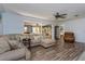 Spacious living room with comfortable seating, fan and bright, natural light at 1533 Findlay St, Deltona, FL 32725