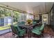 Covered patio with outdoor seating, a grill, and views of the backyard and shed at 1533 Findlay St, Deltona, FL 32725