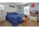 Cozy bedroom with a queen bed and light blue walls at 315 Aldridge Ln, Davenport, FL 33897