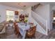 Open dining area adjacent to the living room with a wooden table and chairs at 315 Aldridge Ln, Davenport, FL 33897