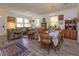 Bright dining room featuring a wood table, hardwood floors, and decorative accents at 315 Aldridge Ln, Davenport, FL 33897