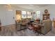 Cozy living room with hardwood floors, comfortable sofas, and a charming aesthetic at 315 Aldridge Ln, Davenport, FL 33897
