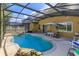 Inviting screened pool area with a patio and lounge chairs at 315 Aldridge Ln, Davenport, FL 33897