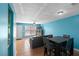 Combination living and dining room featuring tile floors, blue walls, and natural light at 3390 Cedar Spring Pl # 163, Winter Park, FL 32792