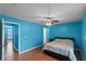 Spacious bedroom with laminate floors, a ceiling fan, and a comfortable bed at 3390 Cedar Spring Pl # 163, Winter Park, FL 32792