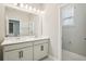 Bathroom featuring double sink vanity and a separate toilet area, all adorned in neutral tones at 5015 Railroad Vine Aly, Winter Garden, FL 34787