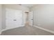 This bedroom features neutral walls, carpet flooring, and a double door closet at 5015 Railroad Vine Aly, Winter Garden, FL 34787