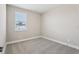 A bedroom featuring neutral walls and carpeted floors with a single window at 5015 Railroad Vine Aly, Winter Garden, FL 34787
