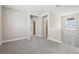 A bonus room featuring neutral walls and carpeted floors with access to two bedrooms at 5015 Railroad Vine Aly, Winter Garden, FL 34787