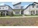 Attractive two-story home with modern design, covered porch, and neat landscaping at 5015 Railroad Vine Aly, Winter Garden, FL 34787