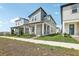 Stylish two-story home featuring modern design, covered porch, and easy sidewalk access at 5015 Railroad Vine Aly, Winter Garden, FL 34787