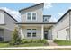 Charming two-story home with modern design, covered porch, and manicured landscaping for curb appeal at 5015 Railroad Vine Aly, Winter Garden, FL 34787