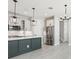 Modern kitchen featuring a center island, stainless steel appliances, and stylish pendant lighting at 5015 Railroad Vine Aly, Winter Garden, FL 34787
