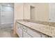 This bathroom features white cabinetry, a granite countertop, and one sink at 3303 Kayak Way, Orlando, FL 32820
