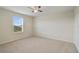 This bedroom features carpet, white walls, and a window with blinds at 3303 Kayak Way, Orlando, FL 32820