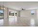 Spacious living room with tile floors and sliding doors to a screened lanai at 3303 Kayak Way, Orlando, FL 32820
