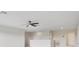 Open loft area with neutral walls, ceiling fan and half wall at 3303 Kayak Way, Orlando, FL 32820